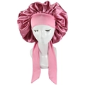 Detailed view of pink satin sleep bonnet featuring wide elastic ties and soft glossy fabric - Korean Pink