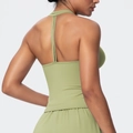 Back view of sage green yoga vest featuring a T-shaped strap design and slim fit - Lime Green