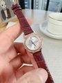 Detail of burgundy leather strap and octagonal diamond-set bezel on rose gold watch - Brown