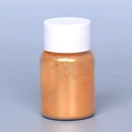 Metallic bronze pearlescent mica powder in a clear cylindrical bottle with white cap - Pearl Powder #6 Red Gold