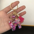 Detail of resin letter N keychain with colorful stones, pink glitter ball and tassel - Small Ball Tassel Clasp / Letter N