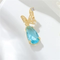 Detailed view of 14k gold butterfly pendant with a blue crystal and zircon inlays - H-10943 Butterfly Teardrop
