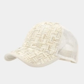 Close-up of natural straw weave texture and white mesh panels on a baseball cap - Adjustable / Beige