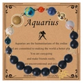Aquarius zodiac lava stone bead bracelet with star charms on a craft paper gift card - Aquarius