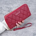 Red long wallet for women featuring diamond quilting and gold zipper with wristlet strap - Burgundy