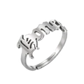 Macro detail of silver stainless steel adjustable ring featuring gothic Icon lettering - Honey / Silver