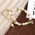 Elegante bracciale di perle con ciondolo a cuore dorato e catena regolabile scorrevole, 15-25 cm - Oro
