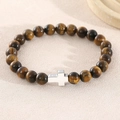 Bracciale di perline in occhio di tigre con ciondolo a croce d'argento su superficie - Perle da 8mm (NAM01-10) / Occhio di Tigre Giallo