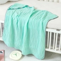 Detail of mint green 6-layer cotton gauze baby blanket with soft breathable texture - Emerald Green