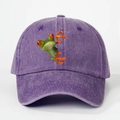 Detailed view of the purple washed cotton baseball cap with a 3D green tree frog print - Purple