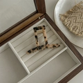 Detail view of a vintage leopard acetate hair claw clip inside a wooden jewelry box - T-Shaped Alloy Claw