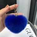 Close-up of royal blue heart-shaped plush keychain with gold lobster clasp and ring - Sapphire Blue