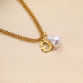Gold letter G initial necklace with white baroque pearl on elegant silk background - Letter G Necklace
