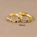 Detail of 10mm gold huggie hoop earrings with multi-color cubic zirconia inlay - 10mm / Gold