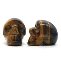 Natural tiger eye stone skull figurine with golden brown silk luster and fine carving - Tiger's Eye