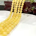 Polished yellow round tiger eye gemstone beads strand for jewelry making and bracelets - High-quality Beige Jade 40 / 6mm / Approx 63pcs
