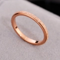 Minimalist titanium steel ring in rose gold finish with matte and polished textures - Rose Gold / US 4