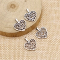 Zinc alloy hollow heart pendants with filigree design on a rustic wooden slice - Antique Silver