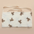 Close-up of muslin cotton bedside organizer featuring brown teddy bear print and ties - Single Bear