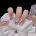 Detail of pink gradient press-on nails with white butterfly and pearl accents - Z492 Crystal Butterfly / Nail Glue Version