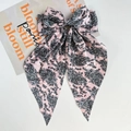Detailed view of pink paisley print satin bow hair clip with long elegant ribbons - Pink Paisley Print Ribbon
