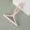 Pink manual lint remover with dual-row brush strips and ergonomic non-slip handle - Light Pink