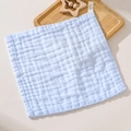 Blue six-layer cotton gauze baby towel with waffle texture on wooden tray - Blue