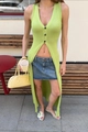 Detail of lime green knit vest featuring three-button closure and deep V-neckline - S / Green