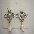 Silver flower earrings with white pearl pendants displayed on a jewelry card - White K Flower Pearl (4698)