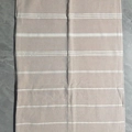 Turkish fringed beach towel with khaki and white stripes on a textured marble background - 90x180cm / Khaki
