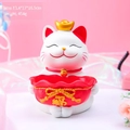 White lucky cat resin storage ornament with red fortune bag and golden ingot detail - 8755 Blessing Bag Storage Ornament