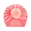 Close-up of pink velvet baby beanie with soft faux fur pompom and detailed fabric texture - One Size / Pink