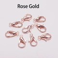 Set of eight polished rose gold lobster clasps for jewelry making on white background - Rose Gold
