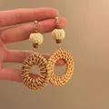 Close-up of bohemian woven rattan circle earrings with wooden beads and metal hooks - 3# 925 Sterling Silver Earring Post - Coffee - Round Rattan Wood Bead