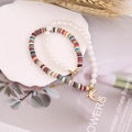 Detail of dolphin charm bracelet set with colorful heishi beads and pearls in shell tray - Colorful Clay Dolphin Charm Style (6#)