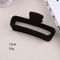 Detail of 13cm black flocked hair claw clip showing 33g weight and internal teeth texture - 13cm Flocked Rectangular Claw Clip Black