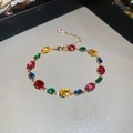 Macro shot of adjustable gold bracelet featuring multi-color faceted crystal gemstones - Oval Gold Multicolor Gemstone Bracelet (9#)