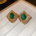 Vintage gold earrings featuring a green teardrop-shaped gemstone on a white display card - 58 Silver Pin-Green