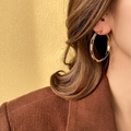 Close-up of model wearing large gold hoop earrings with sparkling rhinestones for women - 12# Gold Large Hoop with Rhinestones (Silver Earring Post)