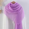 Lavender crinkle cotton linen scarf with frayed edges displayed on a wooden hanger - Lavender