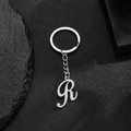 Polished silver stainless steel letter R keychain with artistic font and metal ring - Letter R