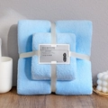 Sky blue coral fleece towel set with white ribbon tie on a wooden surface - Towel + Bath Towel [Mesh Bag] / Blue Coral Fleece