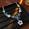 Close-up of elegant blue and white crystal flower necklace on a black jewelry stand - 10# Necklace-Silver-Blue-Water Drop