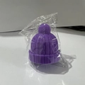Purple beanie hat wine stopper in silicone material with knitted texture and pompom top - Purple