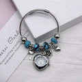 Silver twisted chain bracelet watch with blue flower beads and a heart quartz charm - Blue