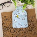 Mini hot water bottle in light blue with cute cartoon moon and cloud patterns - Cloud