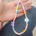 Kralen telefoonkoord met pastelkleurige kralen, paarse strik en blauwe bloemdetails - Macaron Strik Bloem Stijl