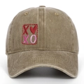 Vintage washed cotton baseball cap featuring embroidered XOXO heart design in tan color - Khaki