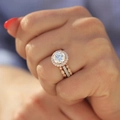 Three-piece rose gold stackable ring set with halo zircon and pavé bands on a hand - US 5 / Rose Gold Halo Zircon 3-Piece Set