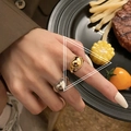 Fashionable heart-shaped golden ring for women shown on hand in a stylish setting - Heart Style (TJZ184)